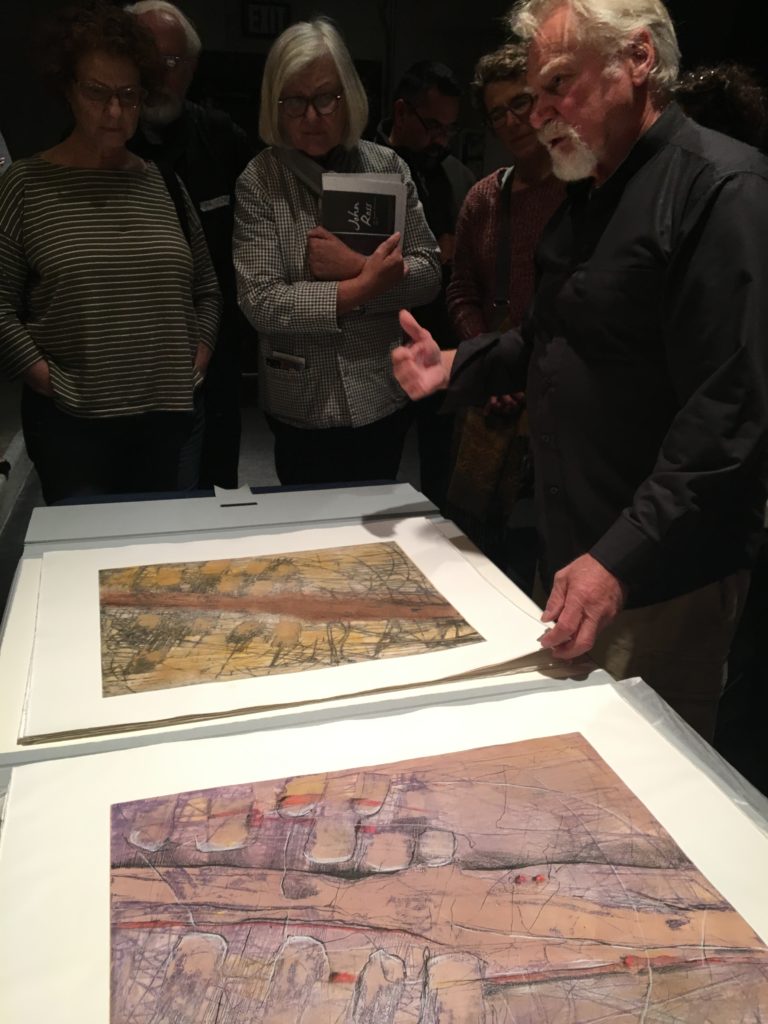 Honorary Member Dan Welden showing prints at the 2018 Annual Meeting.