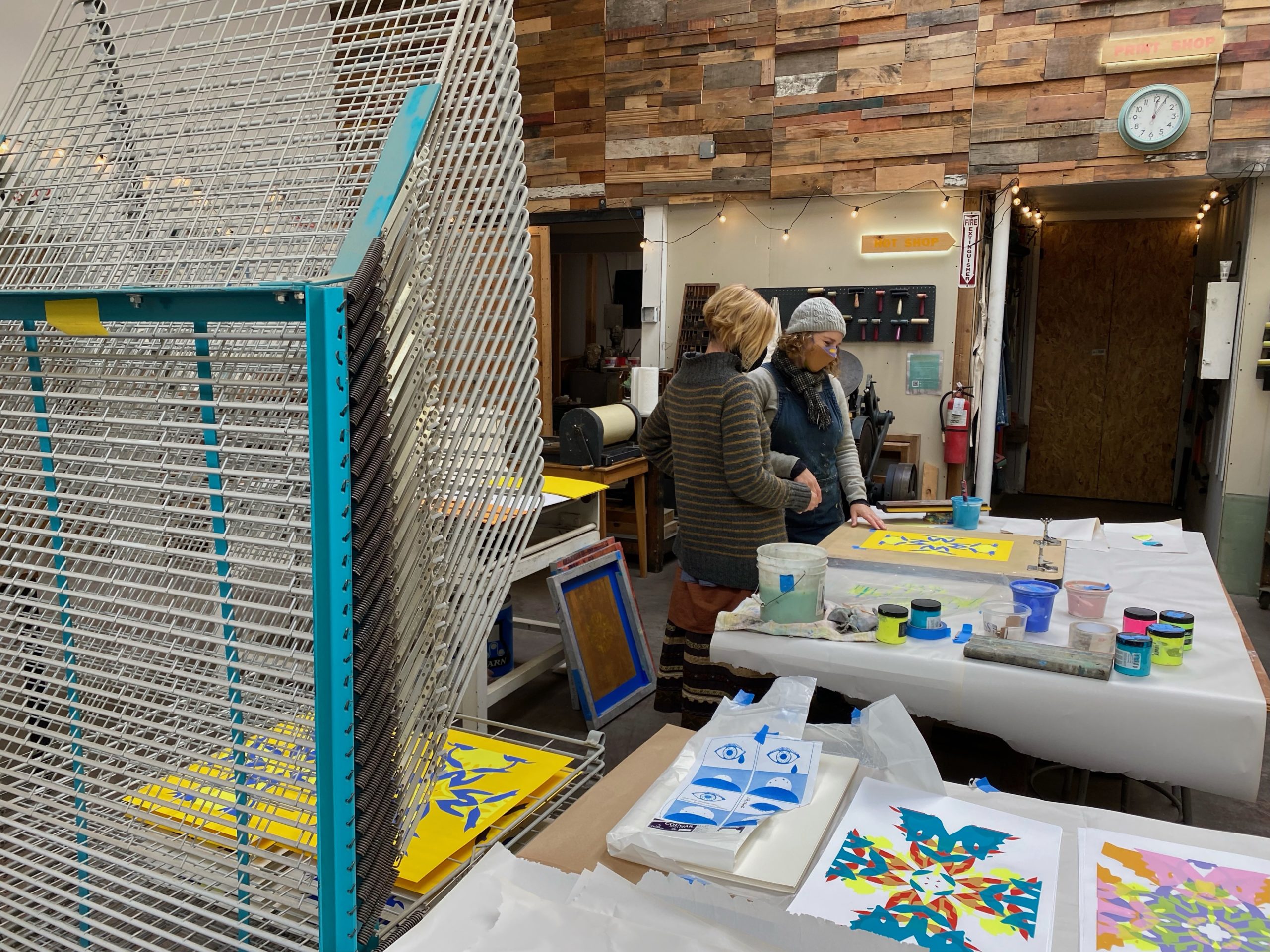 Dana Harris and Sarah Klein discussing a print project at the School of Visual Philosophy